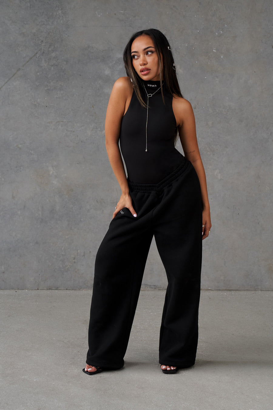 black mock neck bodysuit - women's black dress tops